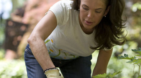 Woman bending over gardening