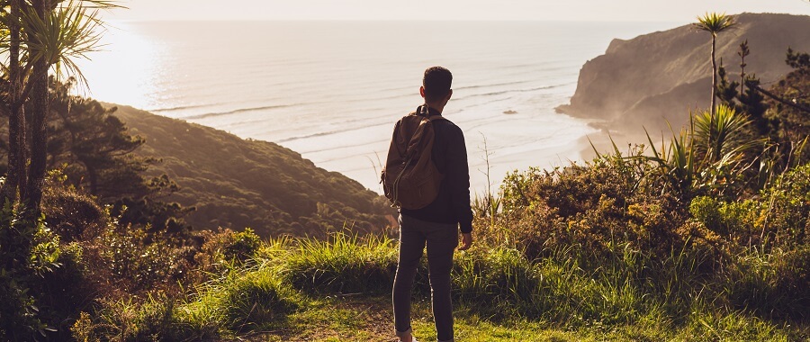 A man looking out at the coastline