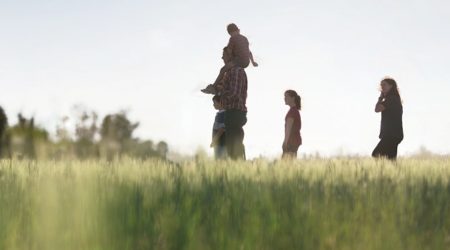Family in a grass field